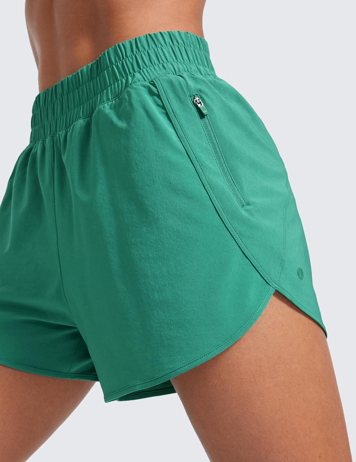 imageCRZ YOGA Dolphin Athletic Shorts for Women 3quot High Waisted Quick Dry for Running Workout Gym Track with Zip PocketCascadia Green