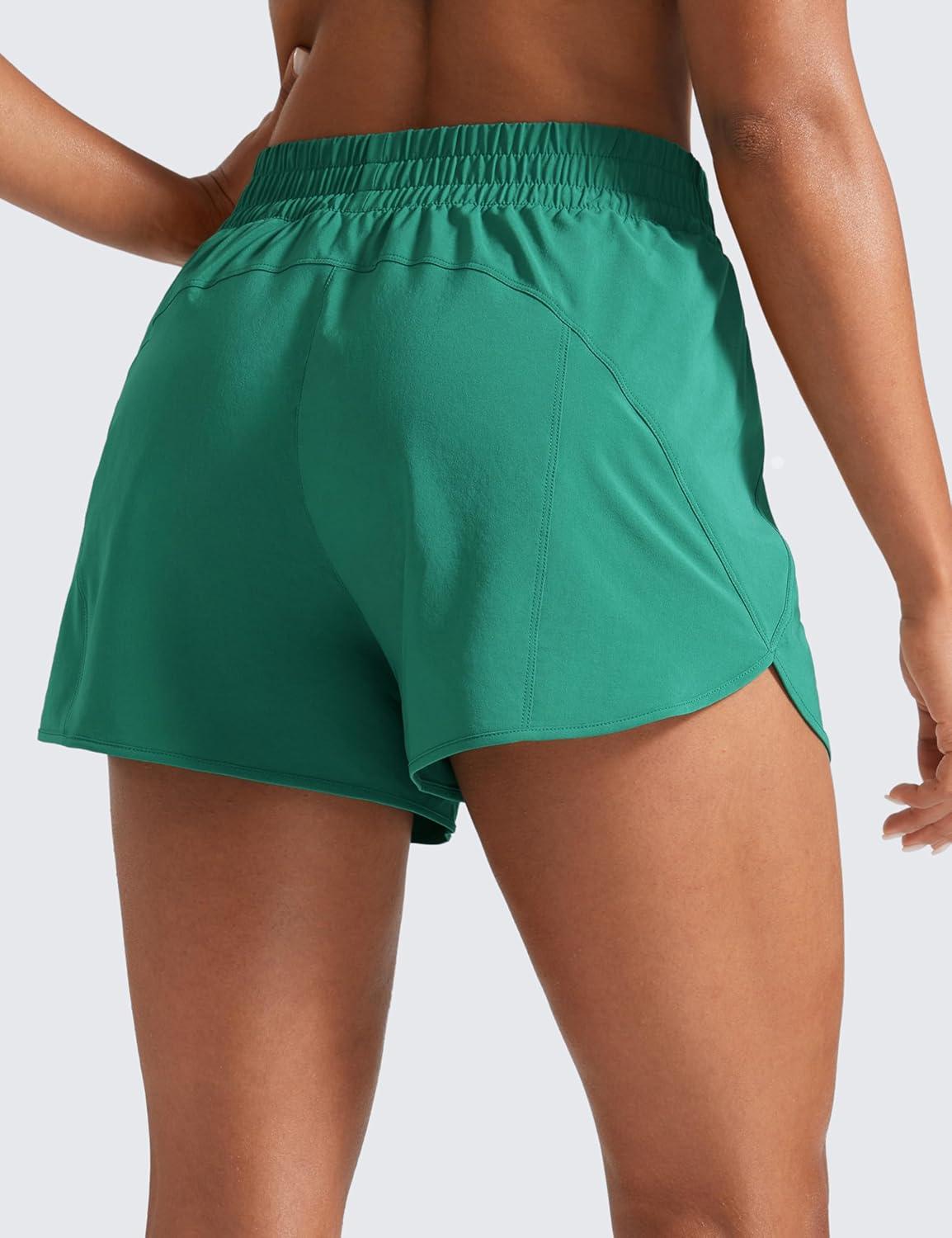 imageCRZ YOGA Dolphin Athletic Shorts for Women 3quot High Waisted Quick Dry for Running Workout Gym Track with Zip PocketCascadia Green