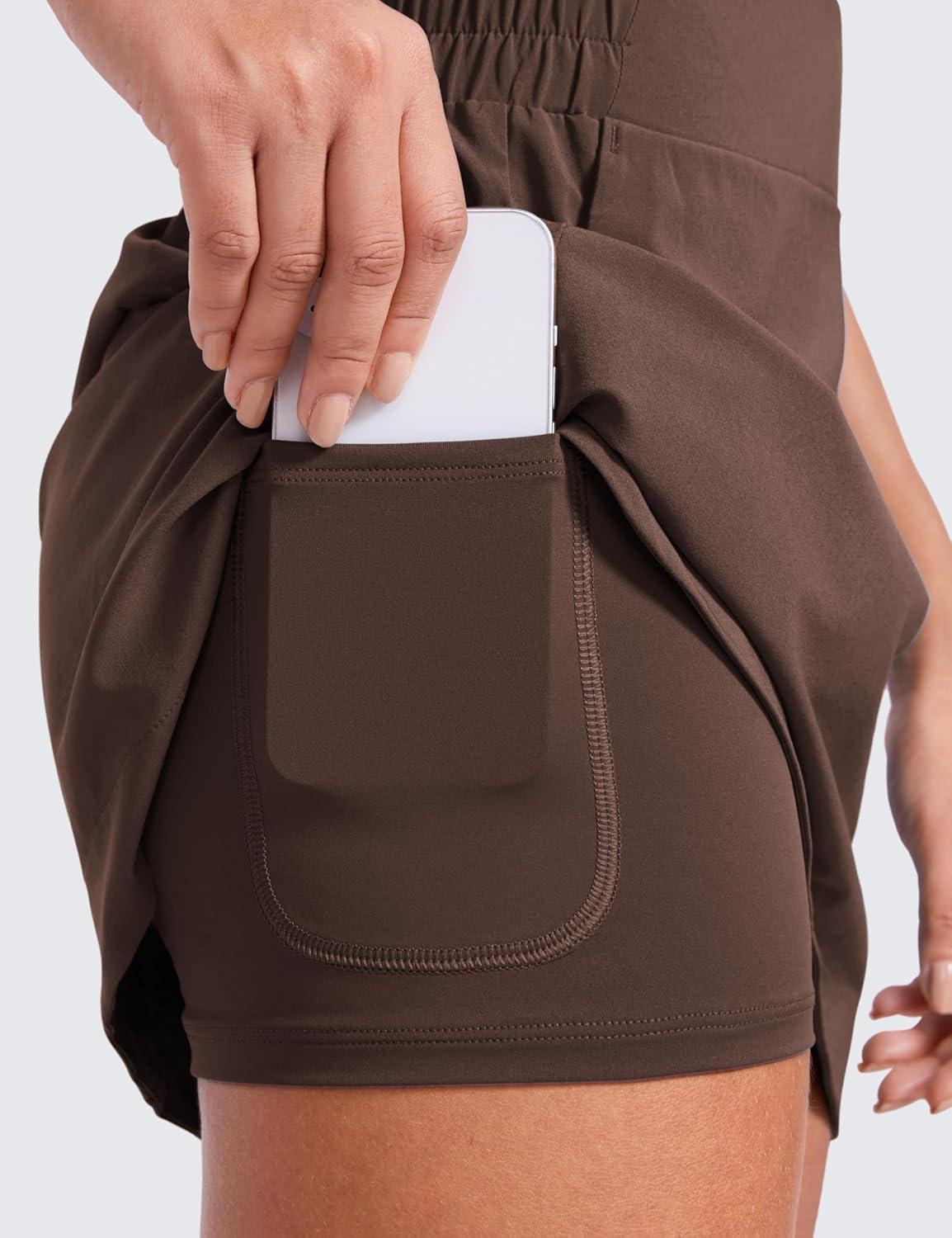 imageCRZ YOGA High Waisted Dolphin Golf Skirts for Women Mini Lined A Line Tennis Casual Skort with Side PocketsHot Fudge Brown