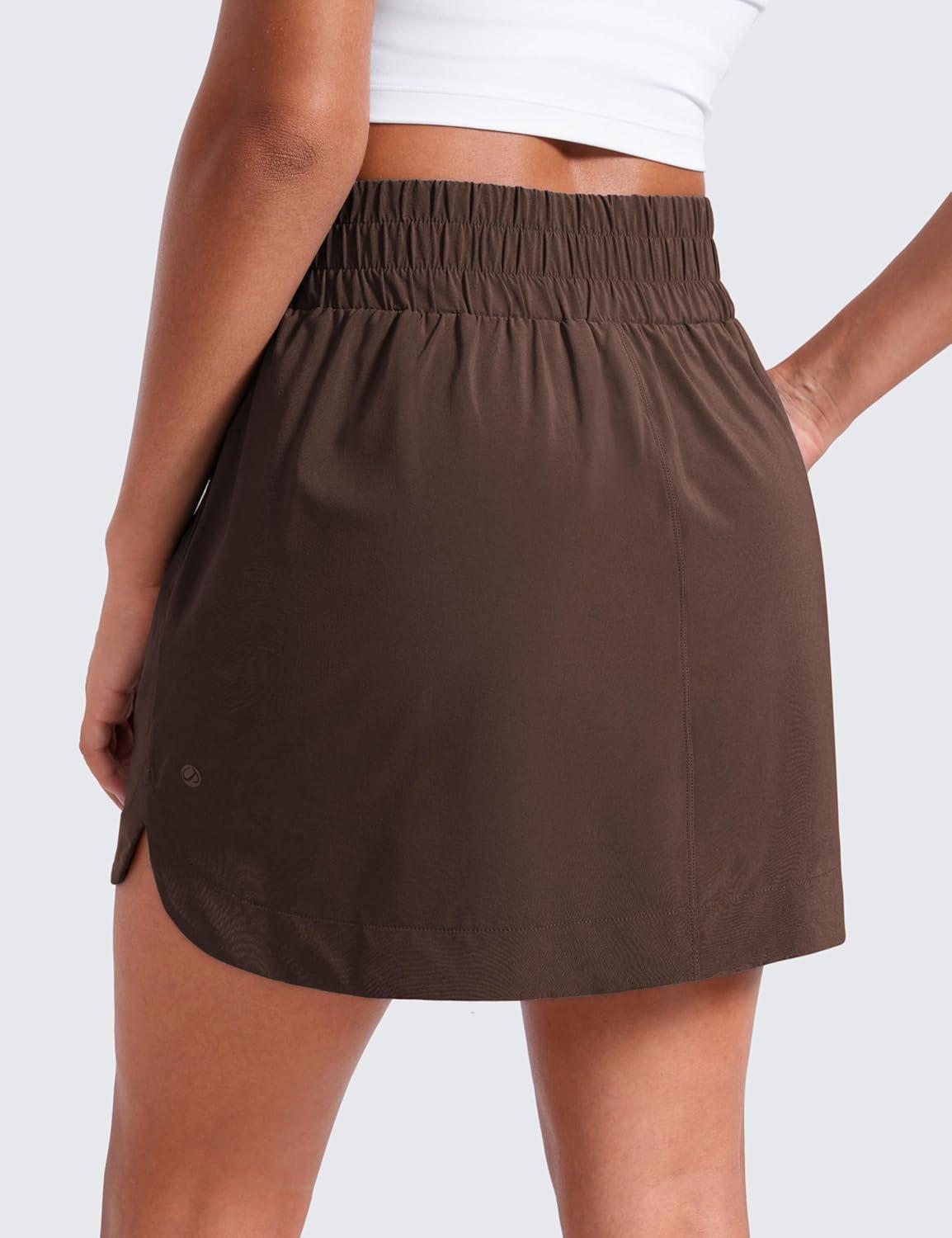 imageCRZ YOGA High Waisted Dolphin Golf Skirts for Women Mini Lined A Line Tennis Casual Skort with Side PocketsHot Fudge Brown
