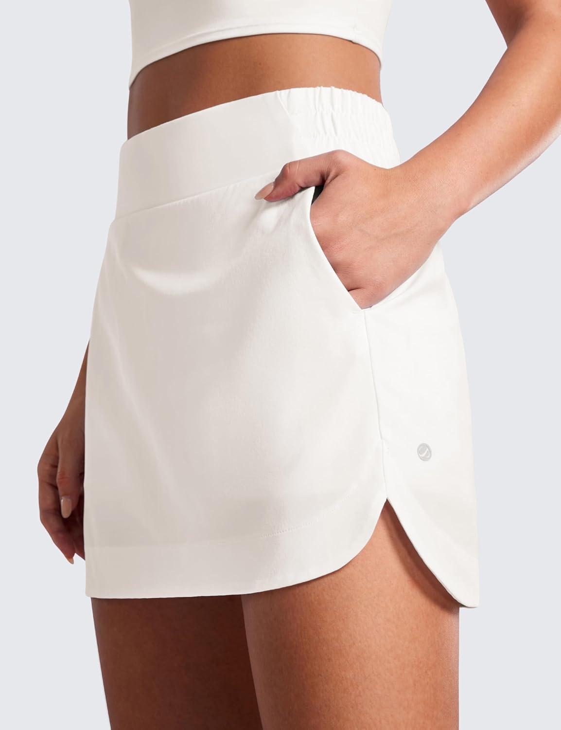 imageCRZ YOGA High Waisted Dolphin Golf Skirts for Women Mini Lined A Line Tennis Casual Skort with Side PocketsMilky White Bone