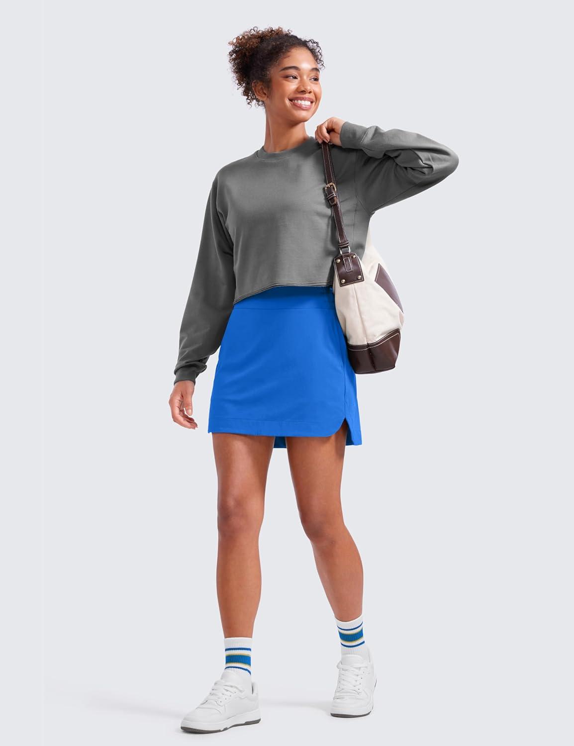 imageCRZ YOGA High Waisted Dolphin Golf Skirts for Women Mini Lined A Line Tennis Casual Skort with Side PocketsSparkle Blue