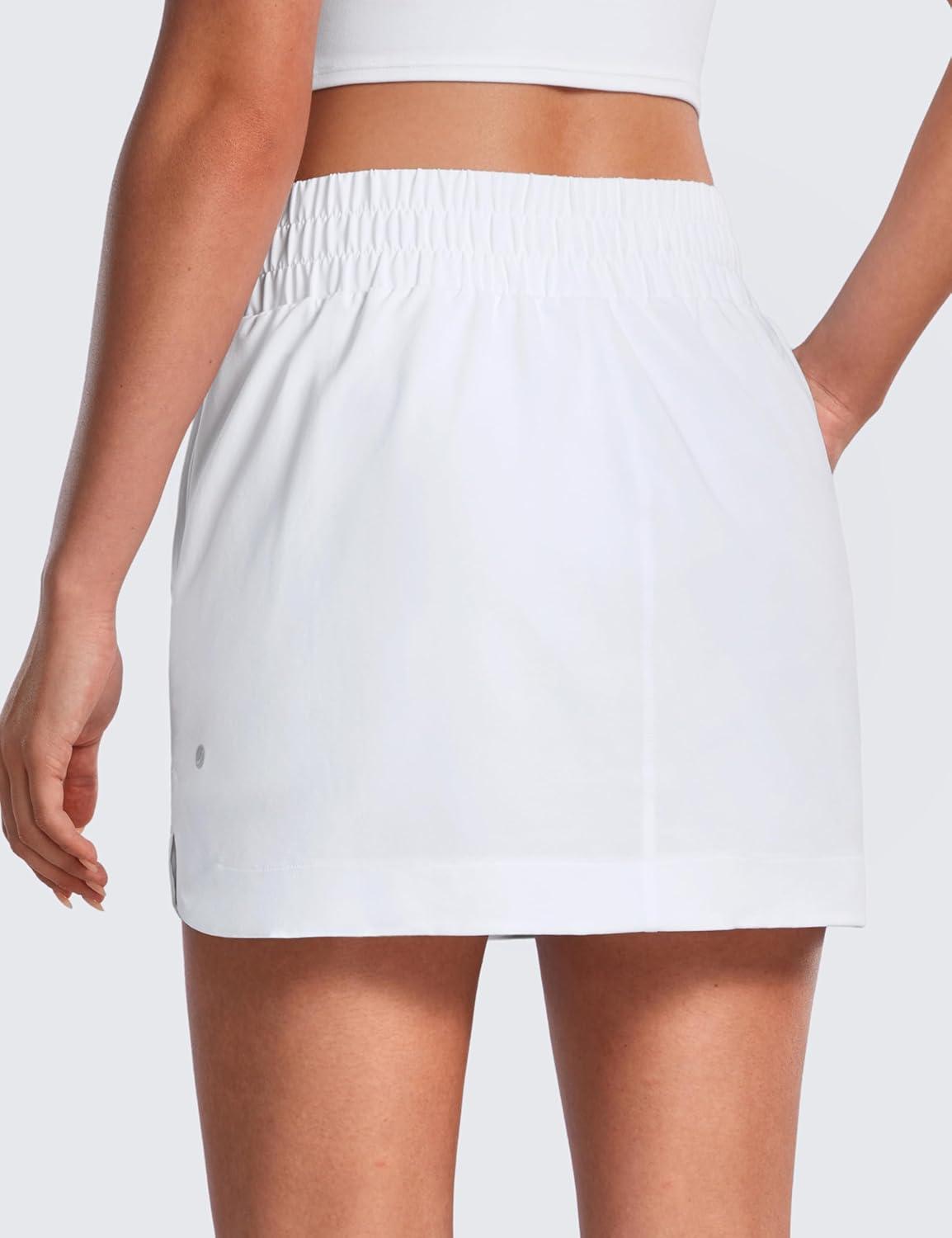 imageCRZ YOGA High Waisted Dolphin Golf Skirts for Women Mini Lined A Line Tennis Casual Skort with Side PocketsWhite