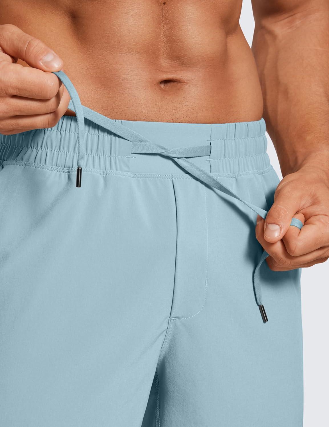 imageCRZ YOGA Mens Linerless Workout Shorts 7 Quick Dry for Running Sports Athletic Gym with PocketsLight Grayish Blue