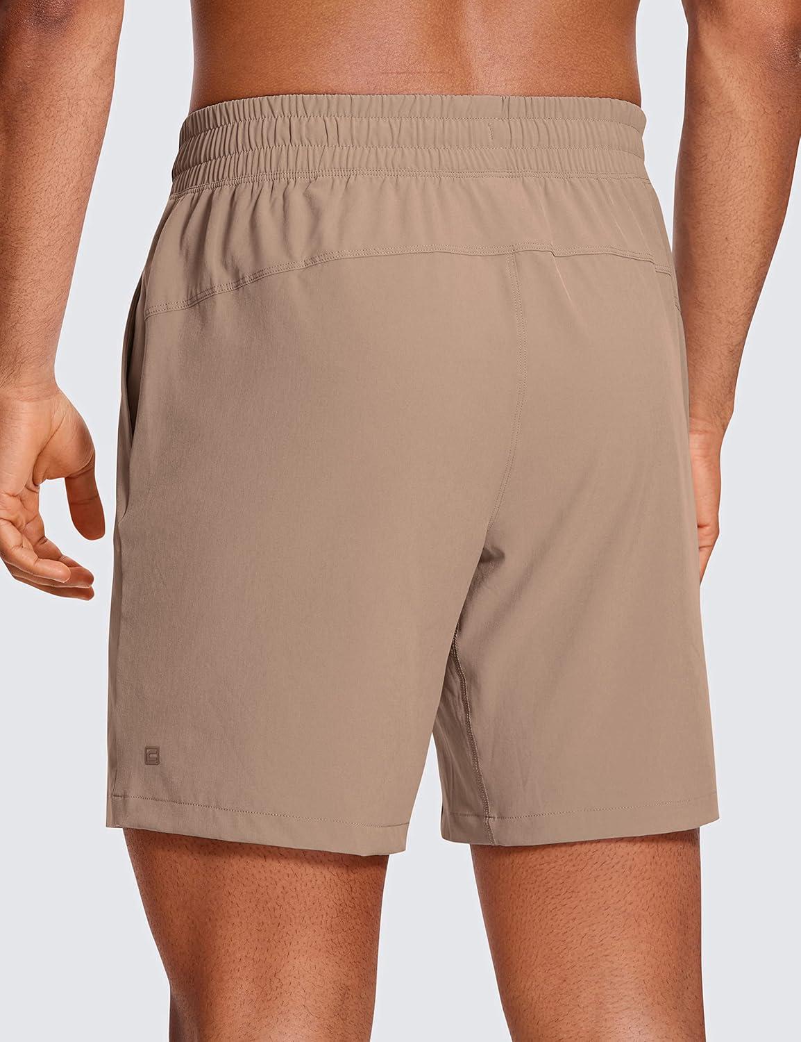 imageCRZ YOGA Mens Linerless Workout Shorts 7 Quick Dry for Running Sports Athletic Gym with PocketsMineral Brown