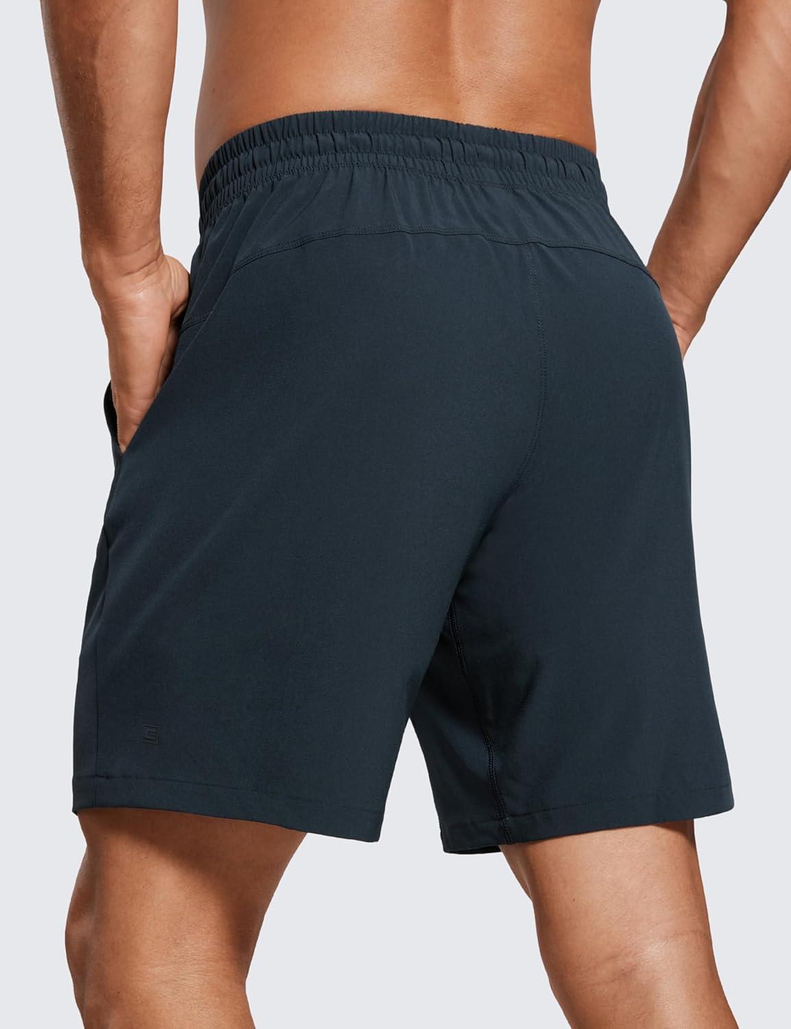 imageCRZ YOGA Mens Linerless Workout Shorts 7 Quick Dry for Running Sports Athletic Gym with PocketsTrue Navy