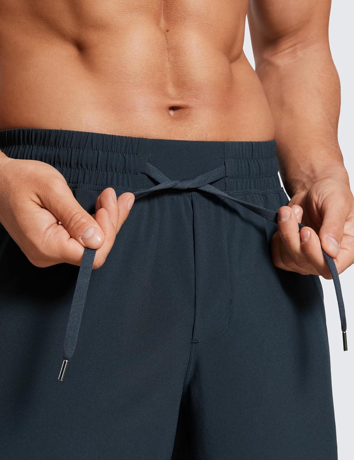 imageCRZ YOGA Mens Linerless Workout Shorts 7 Quick Dry for Running Sports Athletic Gym with PocketsTrue Navy