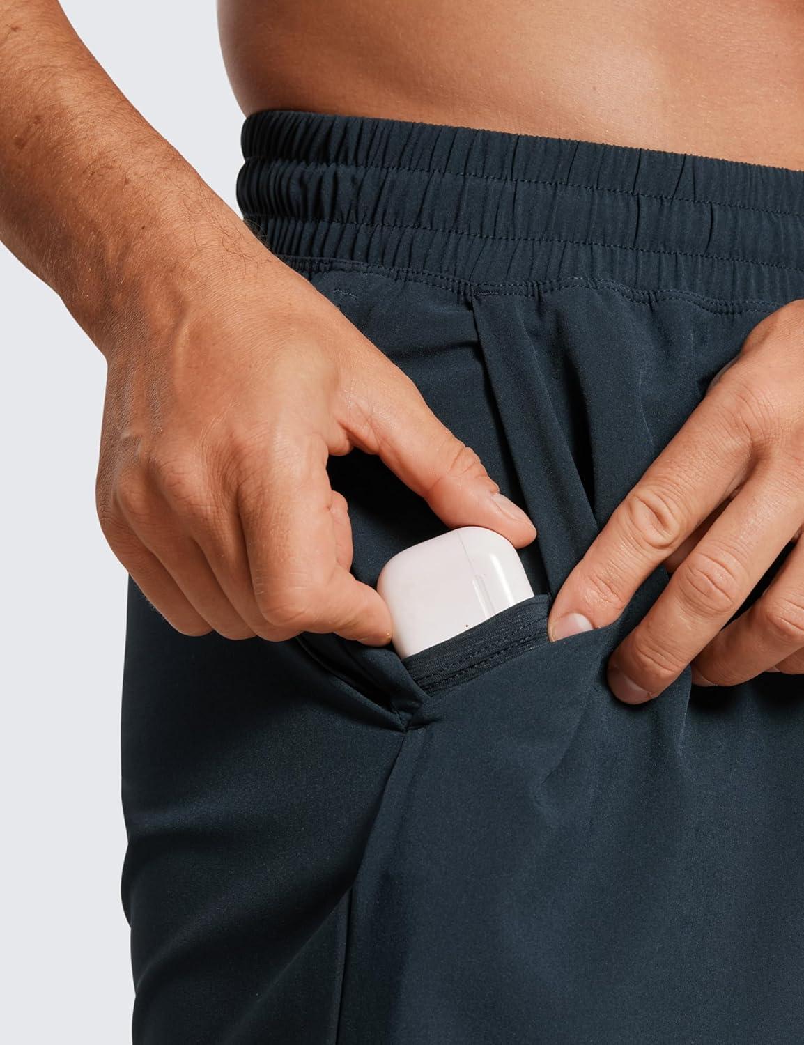 imageCRZ YOGA Mens Linerless Workout Shorts 7 Quick Dry for Running Sports Athletic Gym with PocketsTrue Navy