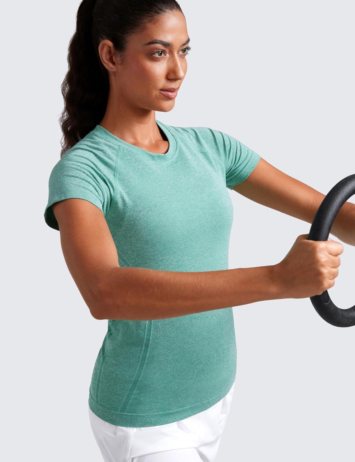 imageCRZ YOGA Seamless Workout Tops for Women Hip Length Athletic Running Gym Yoga Short Sleeve Shirts Breathable Crewneck TeesCascadia Green Heather