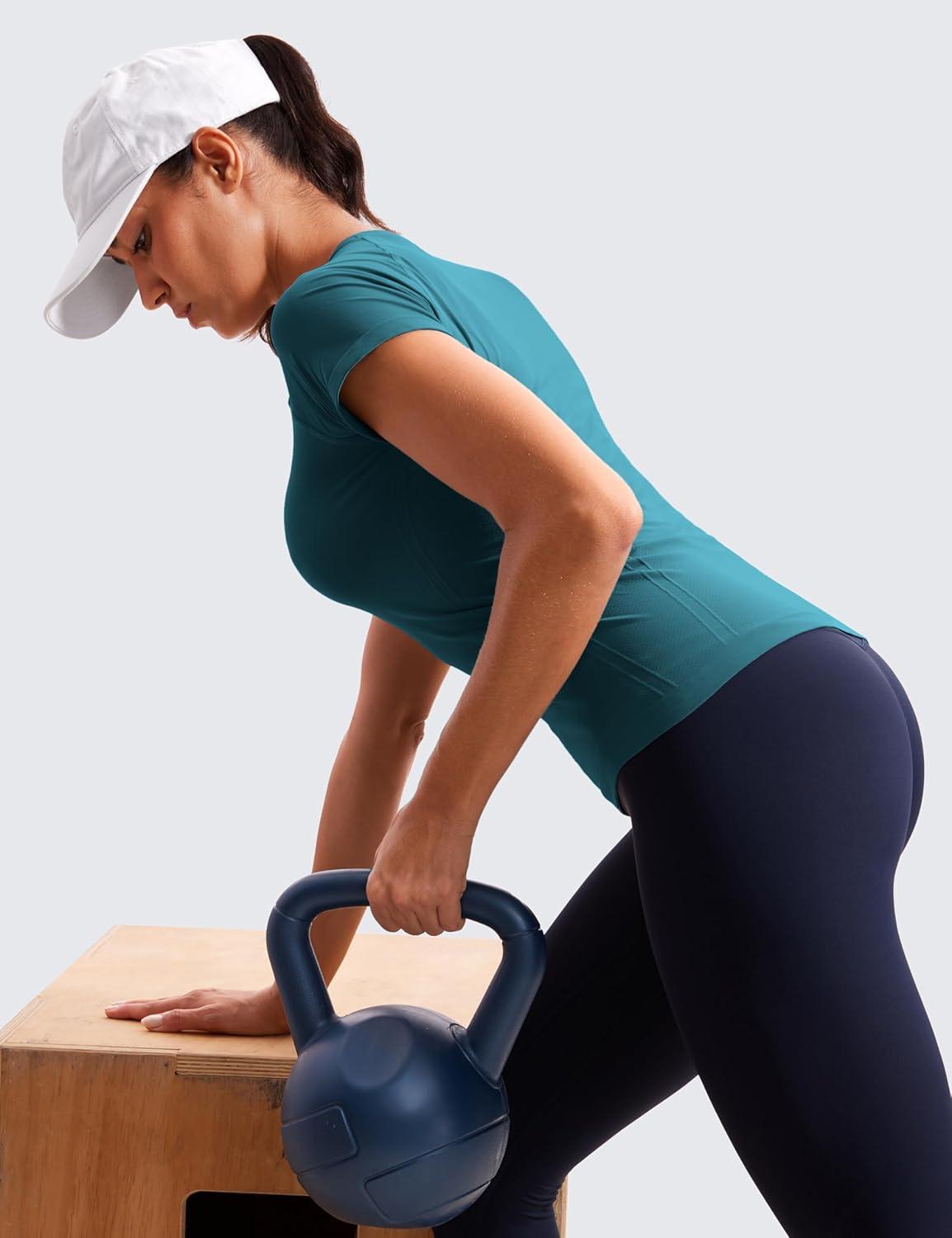 imageCRZ YOGA Seamless Workout Tops for Women Hip Length Athletic Running Gym Yoga Short Sleeve Shirts Breathable Crewneck TeesGreen Jade