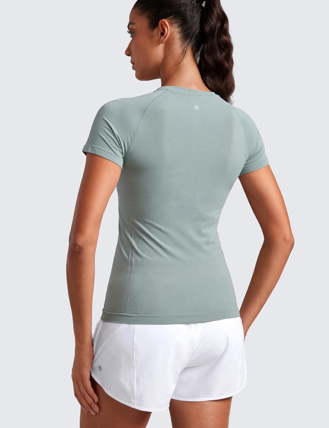 imageCRZ YOGA Seamless Workout Tops for Women Hip Length Athletic Running Gym Yoga Short Sleeve Shirts Breathable Crewneck TeesGreen Palm Court