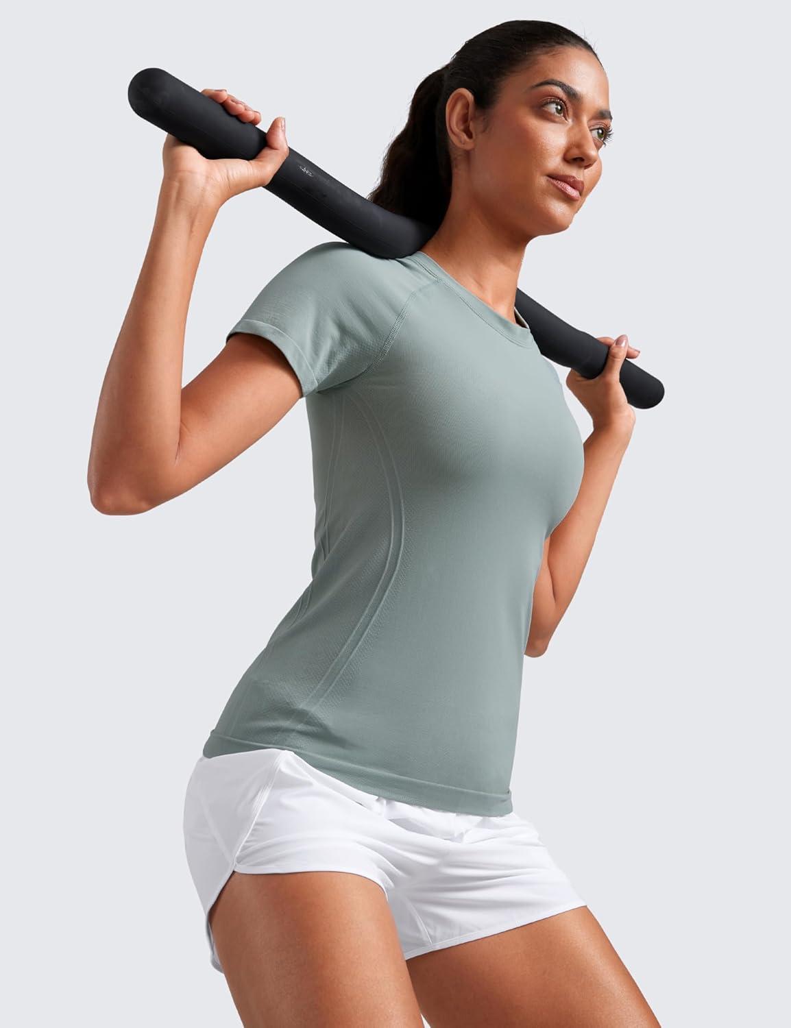 imageCRZ YOGA Seamless Workout Tops for Women Hip Length Athletic Running Gym Yoga Short Sleeve Shirts Breathable Crewneck TeesGreen Palm Court