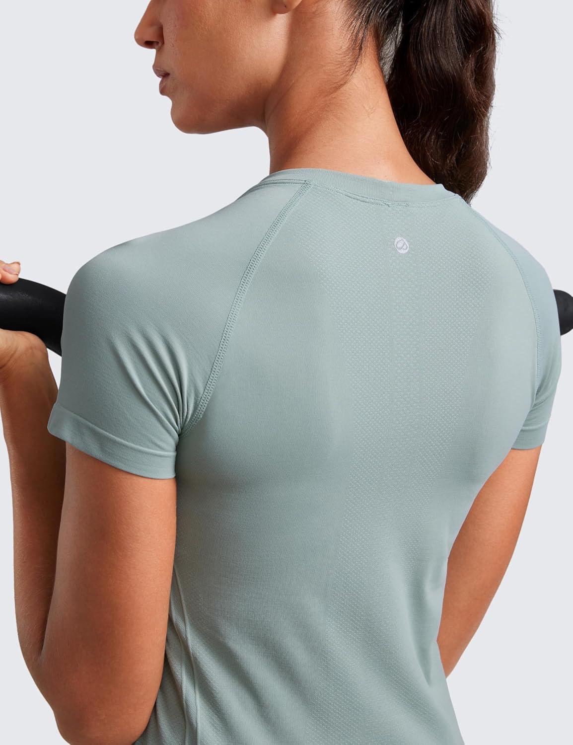imageCRZ YOGA Seamless Workout Tops for Women Hip Length Athletic Running Gym Yoga Short Sleeve Shirts Breathable Crewneck TeesGreen Palm Court