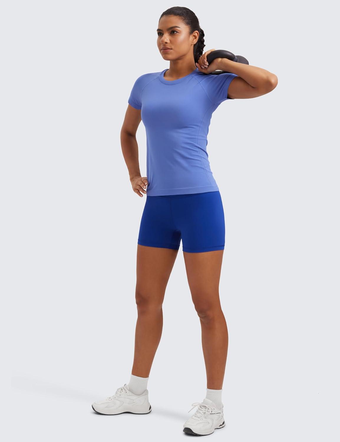 imageCRZ YOGA Seamless Workout Tops for Women Hip Length Athletic Running Gym Yoga Short Sleeve Shirts Breathable Crewneck TeesWild Indigo