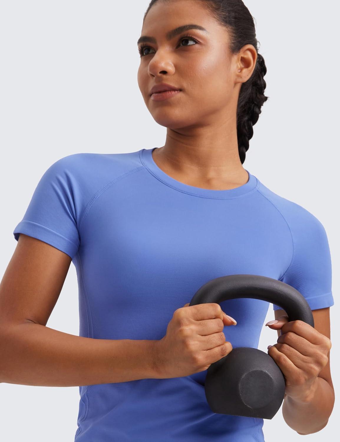 imageCRZ YOGA Seamless Workout Tops for Women Hip Length Athletic Running Gym Yoga Short Sleeve Shirts Breathable Crewneck TeesWild Indigo