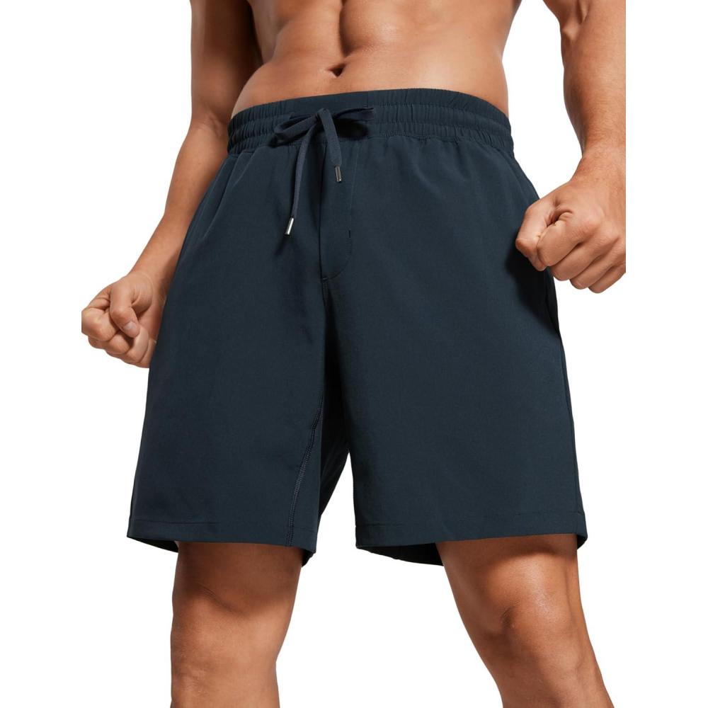 imageCRZ YOGA Mens Linerless Workout Shorts 7 Quick Dry for Running Sports Athletic Gym with PocketsTrue Navy