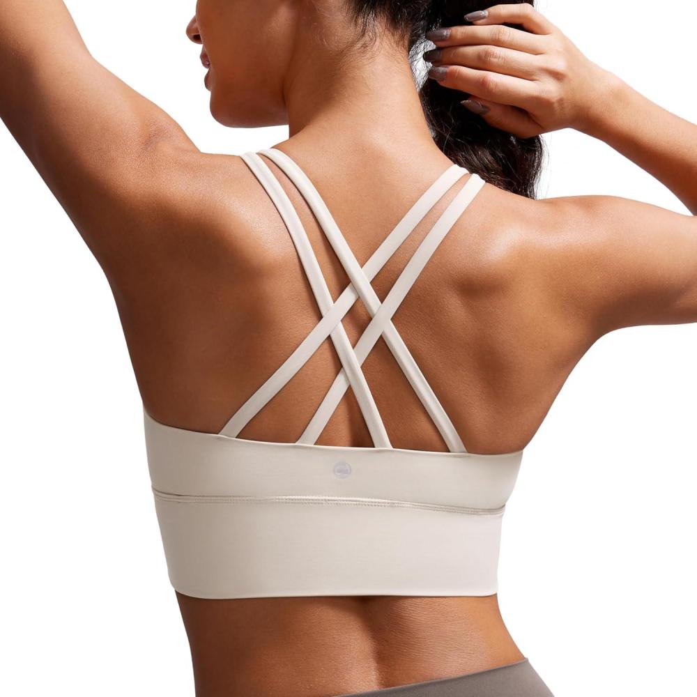 imageCRZ YOGA Naked Feeling Strappy Longline Sports Bras for Women  Medium Impact Criss Cross Yoga Padded Workout Crop TopMojave Tan