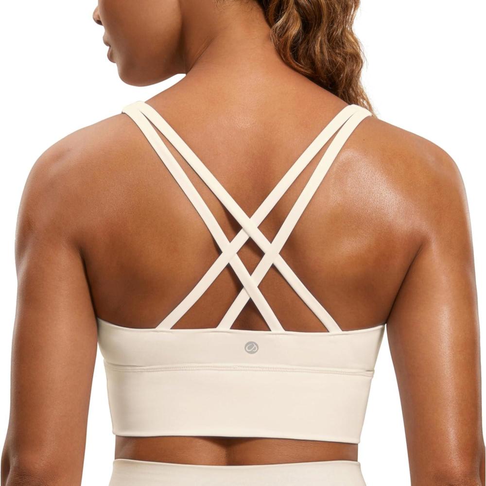 imageCRZ YOGA Naked Feeling Strappy Longline Sports Bras for Women  Medium Impact Criss Cross Yoga Padded Workout Crop TopWhite Apricot