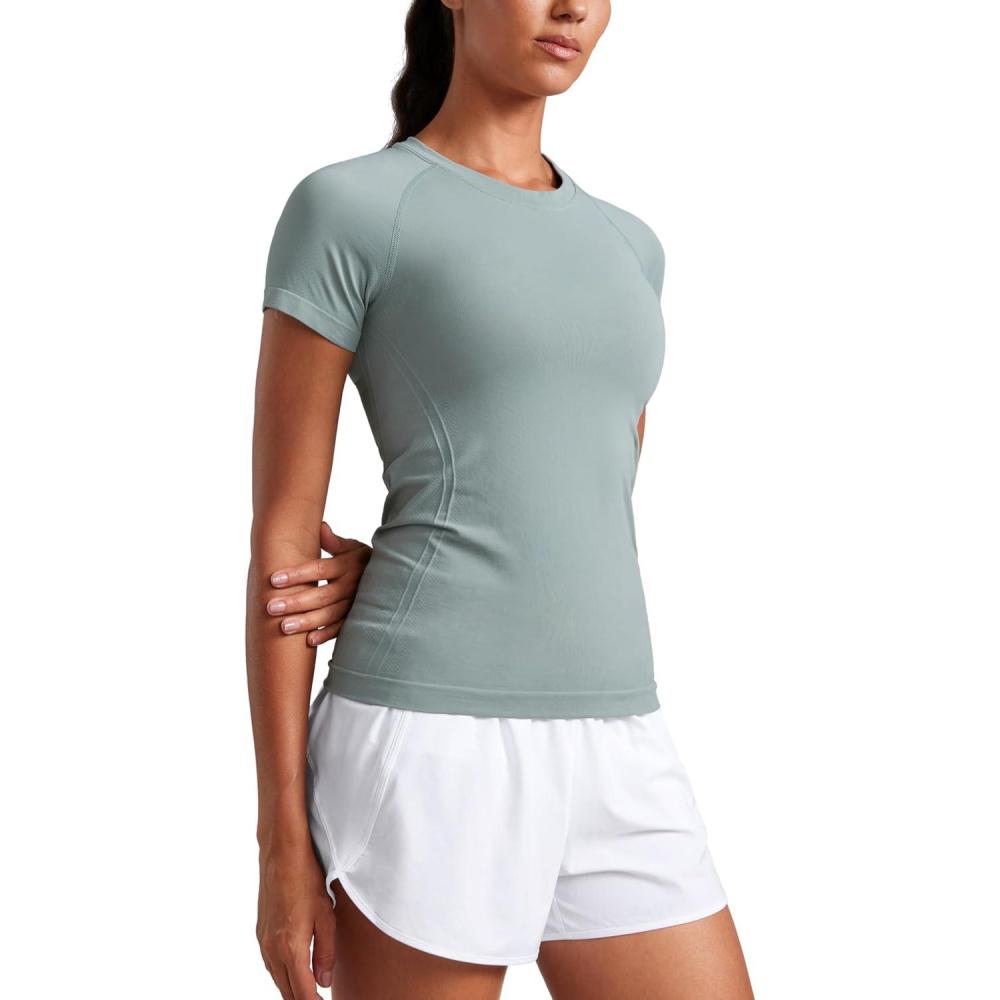 imageCRZ YOGA Seamless Workout Tops for Women Hip Length Athletic Running Gym Yoga Short Sleeve Shirts Breathable Crewneck TeesGreen Palm Court