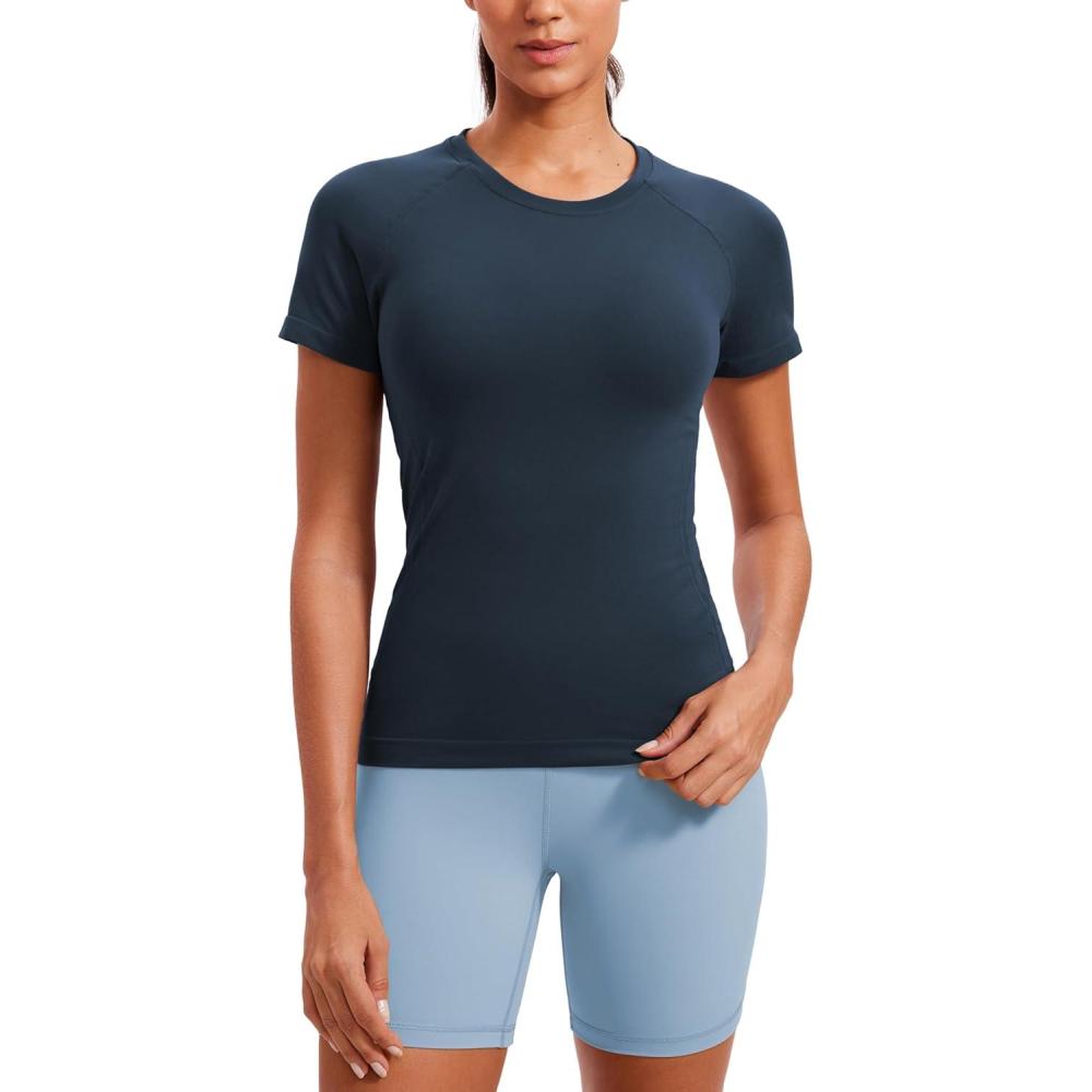 imageCRZ YOGA Seamless Workout Tops for Women Hip Length Athletic Running Gym Yoga Short Sleeve Shirts Breathable Crewneck TeesTwilight Blue