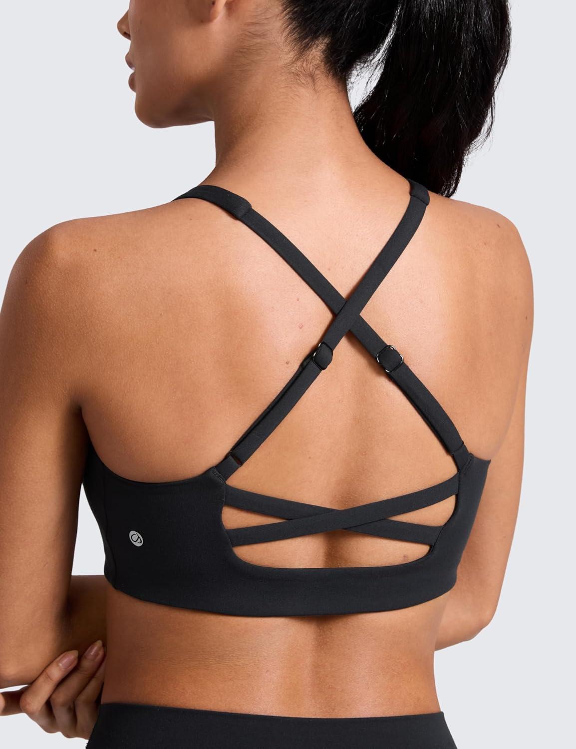 imageCRZ YOGA Butterlift Cross Back Sports Bras for Women Scoop Neck Adjustable Straps Wireless Padded Pilates Workout TopBlack