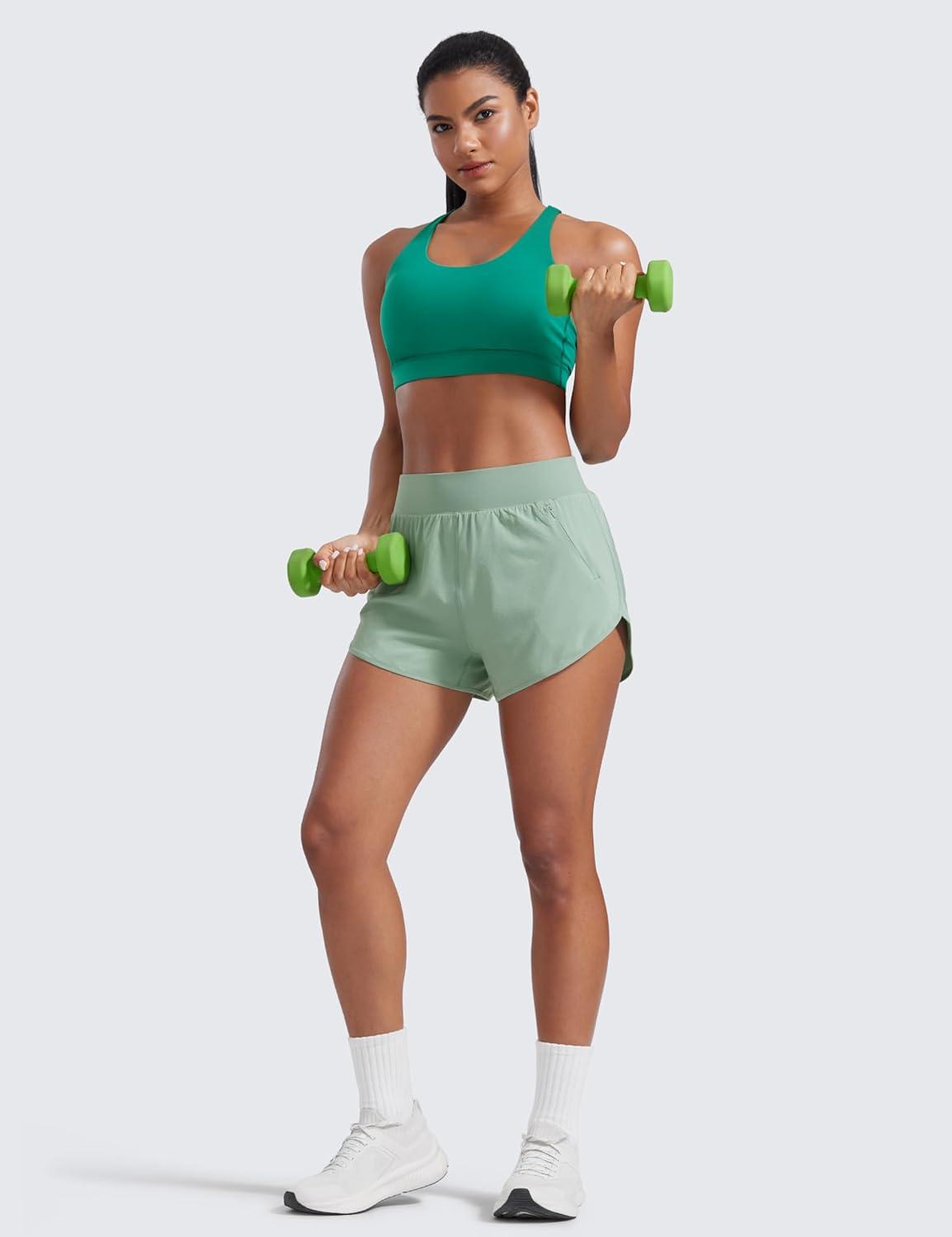 imageCRZ YOGA Dolphin Flat Waist Athletic Shorts for Women 3quot High Rise Quick Dry for Running Workout Gym Track with Zip PocketsGreen Palm Court