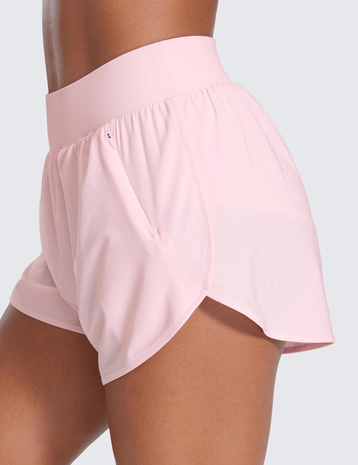 imageCRZ YOGA Dolphin Flat Waist Athletic Shorts for Women 3quot High Rise Quick Dry for Running Workout Gym Track with Zip PocketsStrawberry Pink