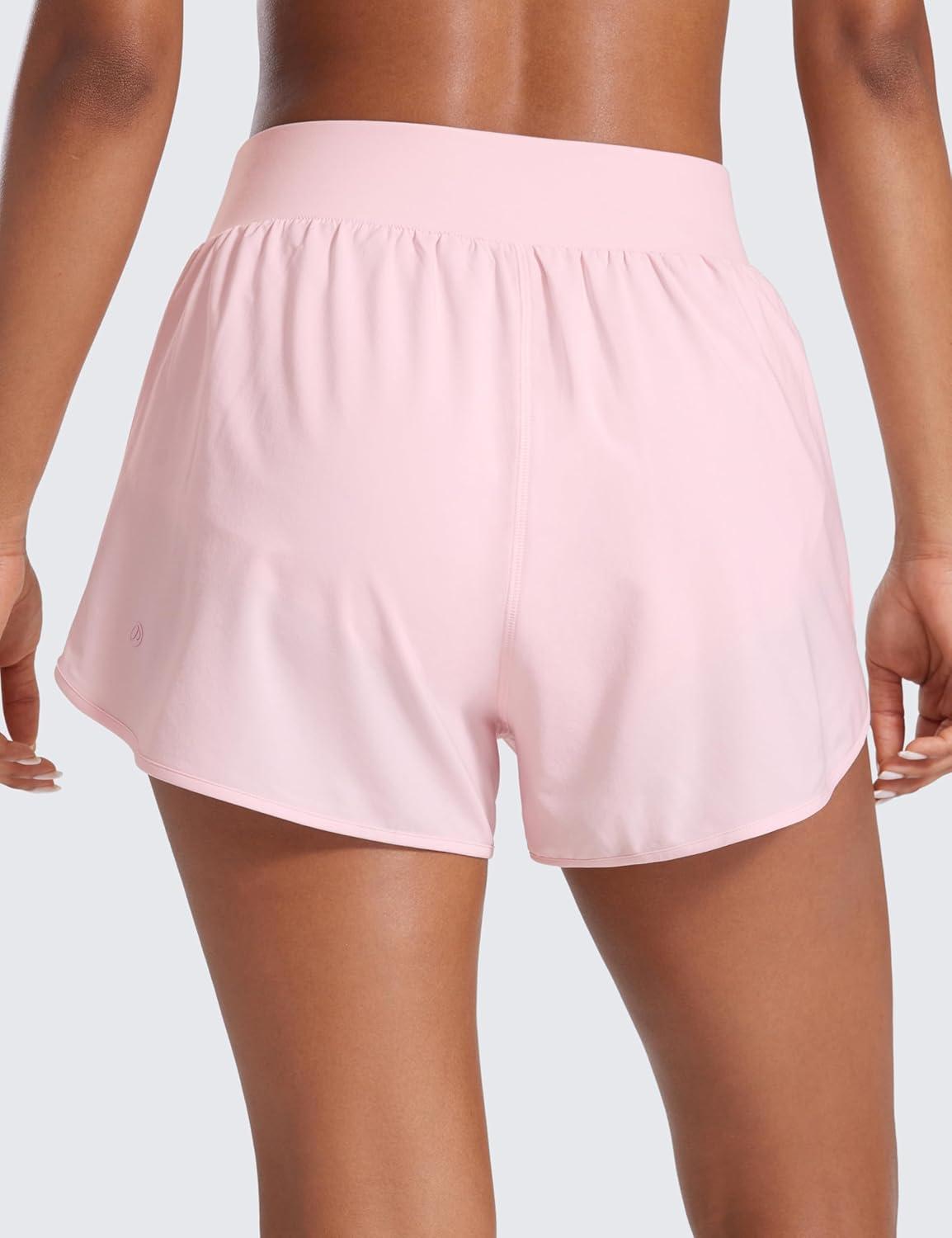 imageCRZ YOGA Dolphin Flat Waist Athletic Shorts for Women 3quot High Rise Quick Dry for Running Workout Gym Track with Zip PocketsStrawberry Pink