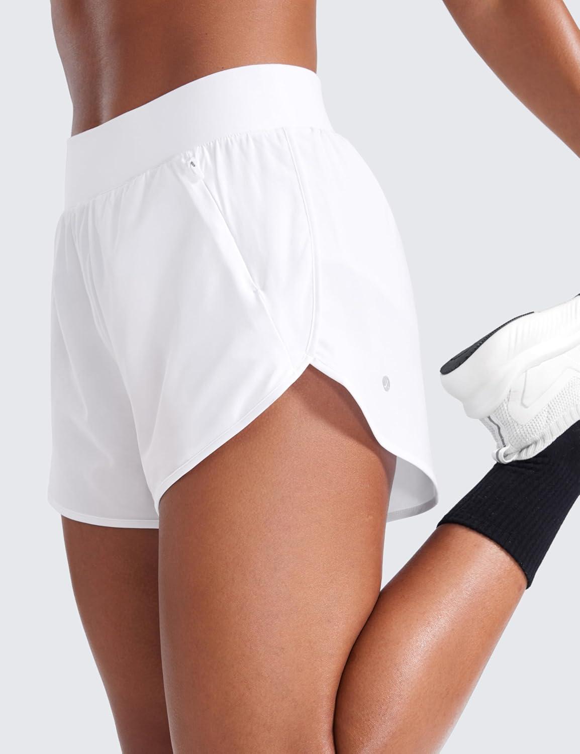 imageCRZ YOGA Dolphin Flat Waist Athletic Shorts for Women 3quot High Rise Quick Dry for Running Workout Gym Track with Zip PocketsWhite
