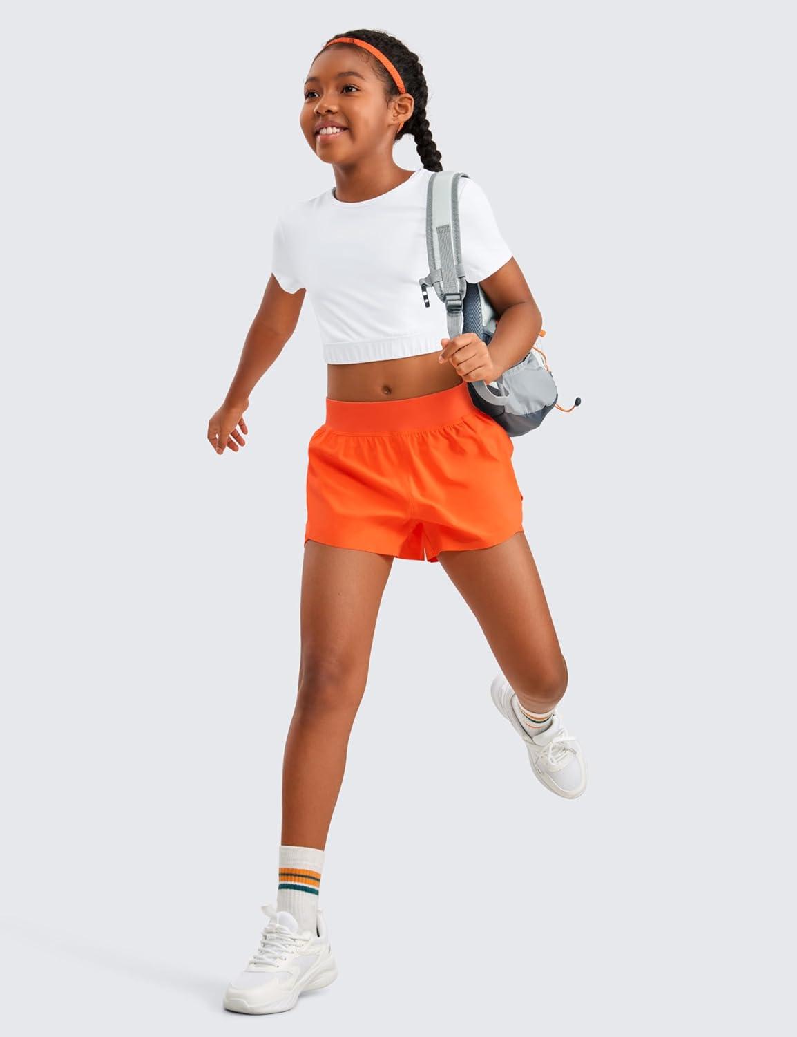 imageCRZ YOGA Girls FeatheryFit Soft 2 in 1 Dolphin Athletic Shorts Tennis Soccer Running Casual Liner Pockets Kids TeenNeon Orange