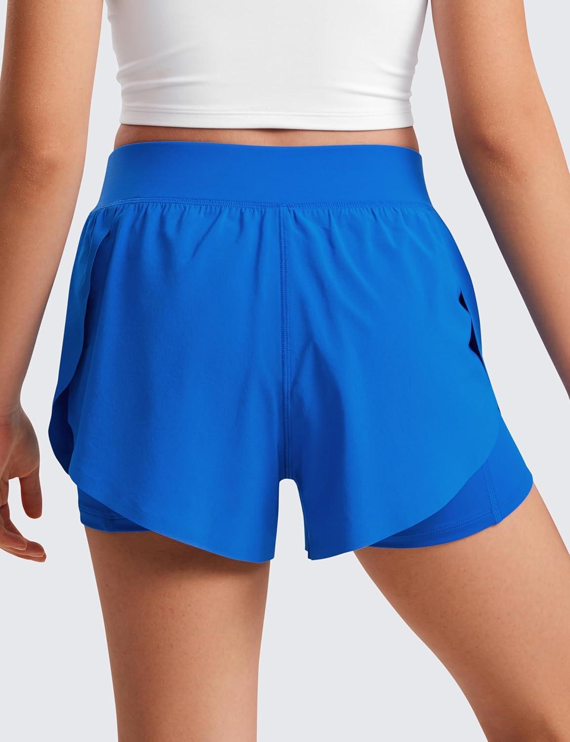 imageCRZ YOGA Girls FeatheryFit Soft 2 in 1 Dolphin Athletic Shorts Tennis Soccer Running Casual Liner Pockets Kids TeenSparkle Blue
