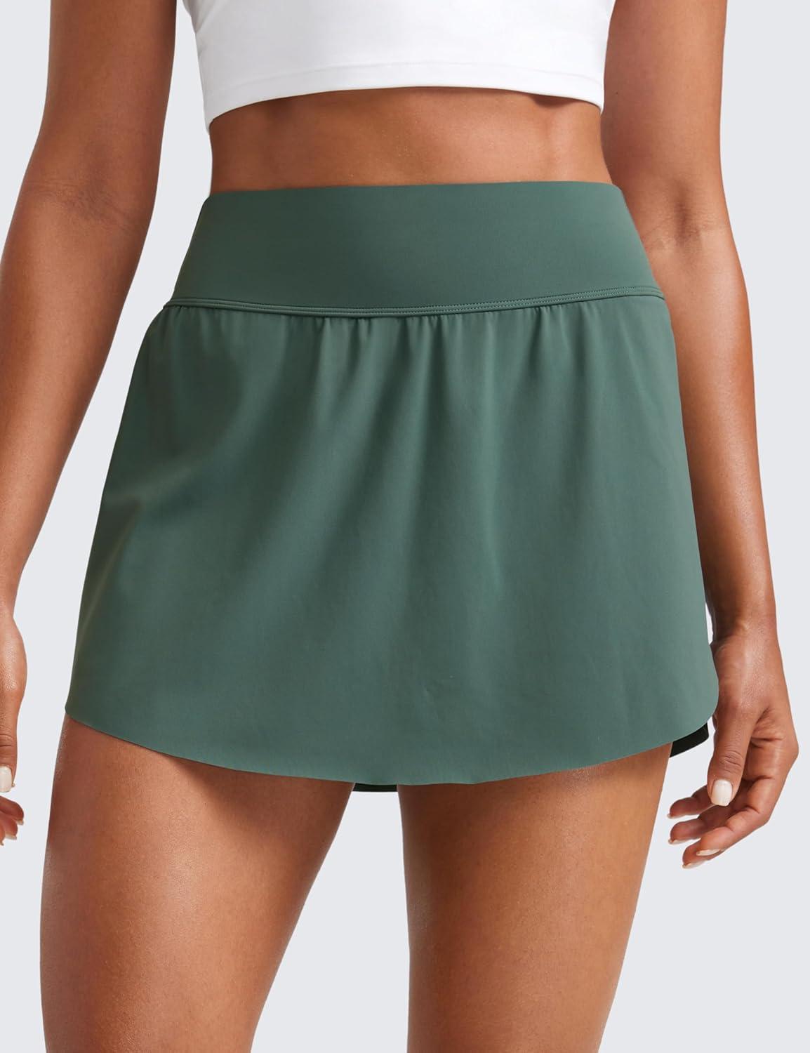 imageCRZ YOGA High Waisted Side Slit Tennis Skirts for Women Mini Lined A Line Running Athletic Skort with Inner PocketsDark Forest Green