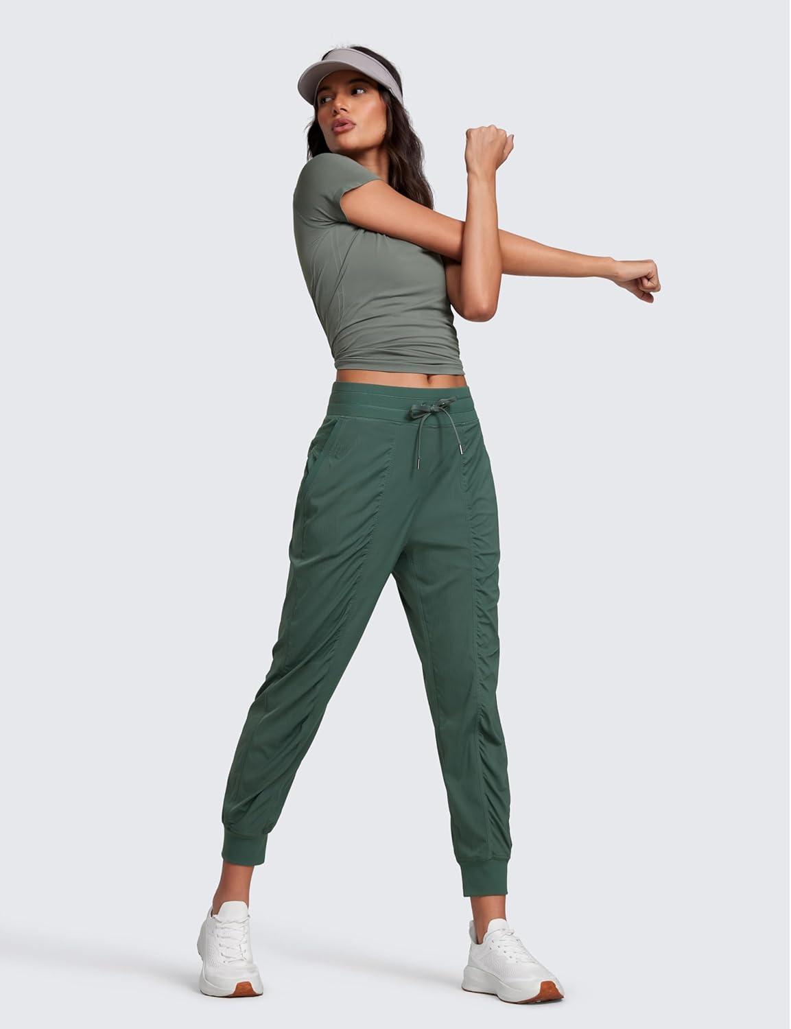 imageCRZ YOGA Lightweight Workout Joggers for Women 26quot285quot305quot Outdoor Running Casual Pants with PocketsDark Forest Green