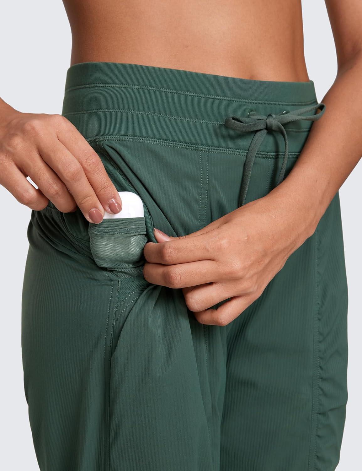 imageCRZ YOGA Lightweight Workout Joggers for Women 26quot285quot305quot Outdoor Running Casual Pants with PocketsDark Forest Green