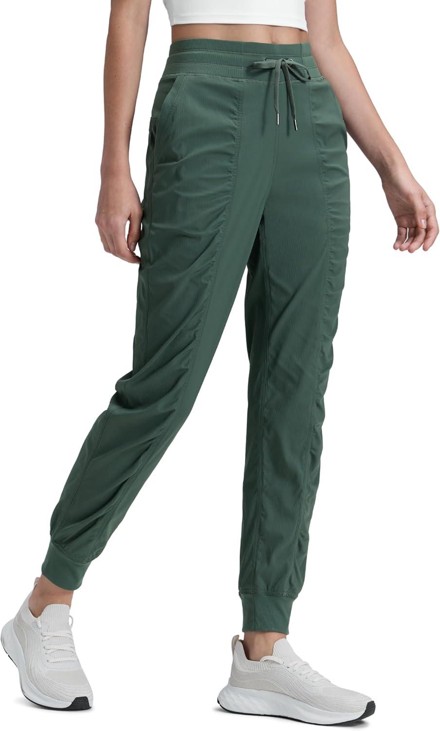 imageCRZ YOGA Lightweight Workout Joggers for Women 26quot285quot305quot Outdoor Running Casual Pants with PocketsDark Forest Green