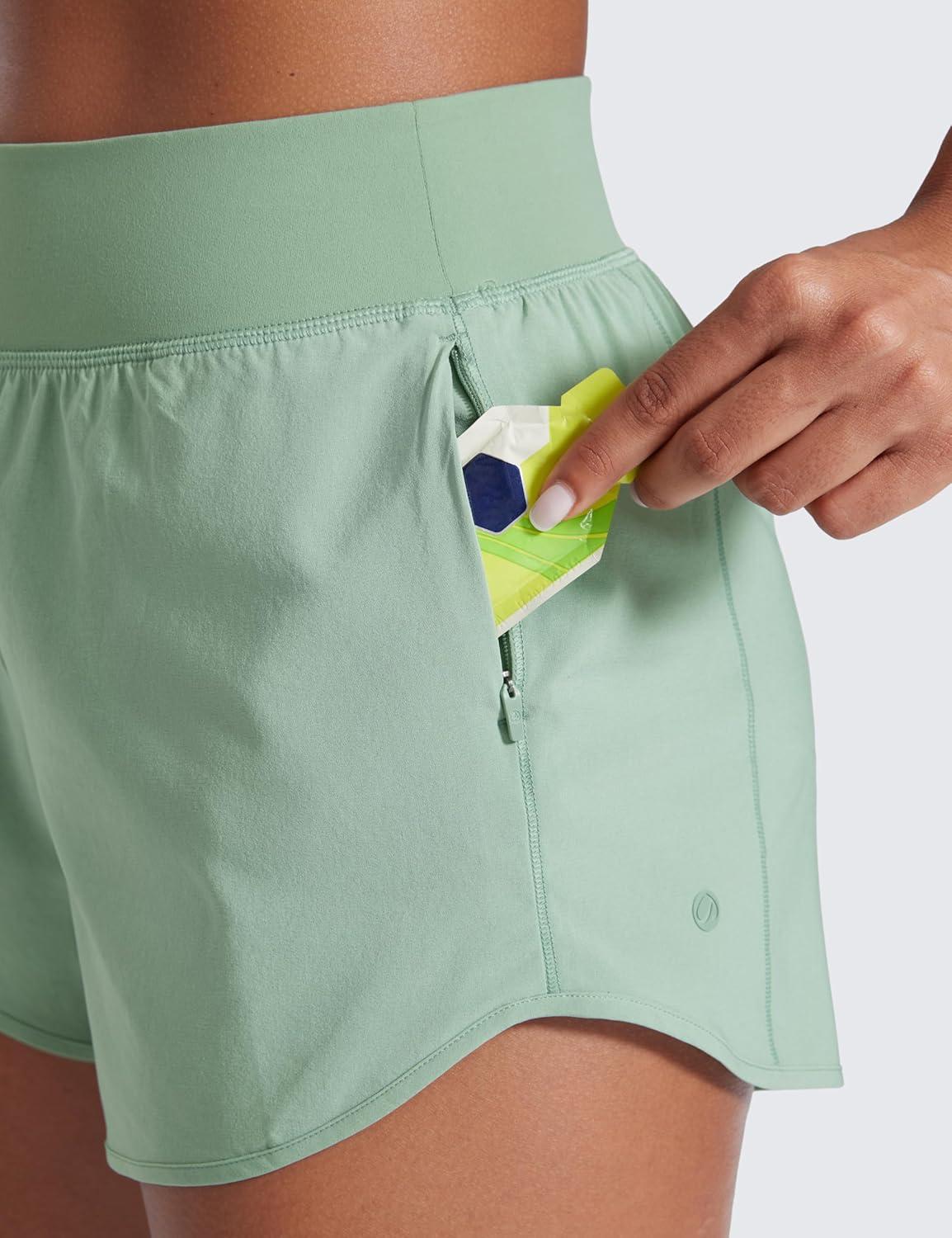imageCRZ YOGA Mid Flat Waisted Running Shorts for Women 3quot Mesh Liner Quick Dry for Workout Sport Athletic with Zipper PocketGreen Palm Court