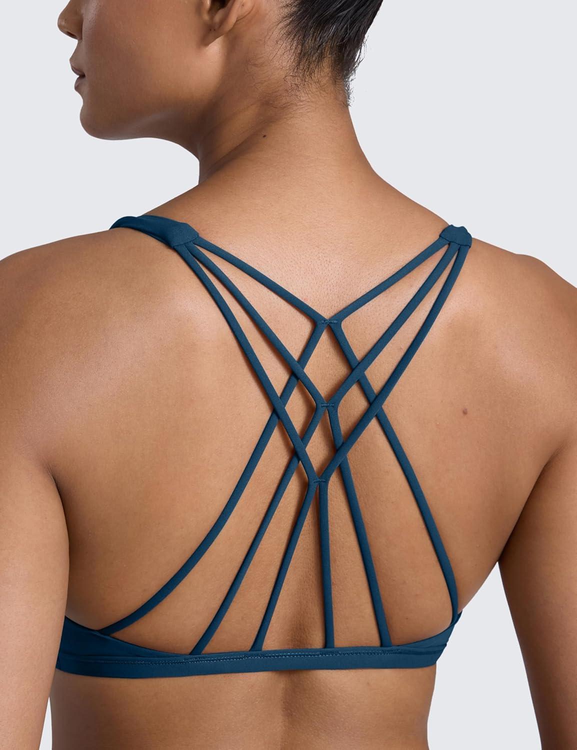 imageCRZ YOGA Womens Naked Feeling Criss Cross Sports Bra Strappy Back Padded Medium Support Wireless Gym Cami Workout YogaFrench Navy