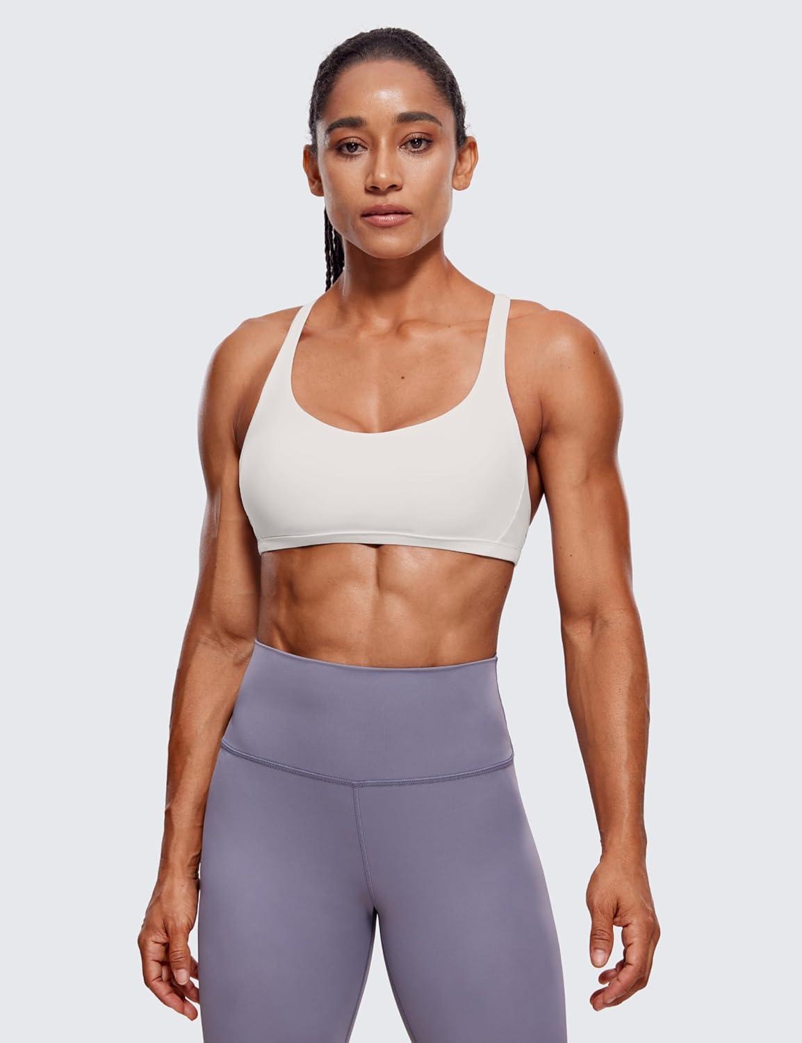 imageCRZ YOGA Womens Naked Feeling Criss Cross Sports Bra Strappy Back Padded Medium Support Wireless Gym Cami Workout YogaMilky White