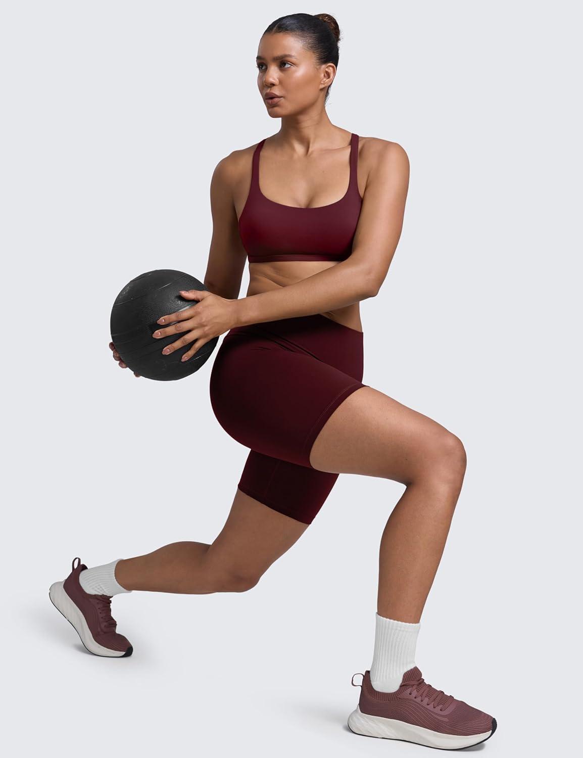 imageCRZ YOGA Womens Naked Feeling Criss Cross Sports Bra Strappy Back Padded Medium Support Wireless Gym Cami Workout YogaRed Merlot