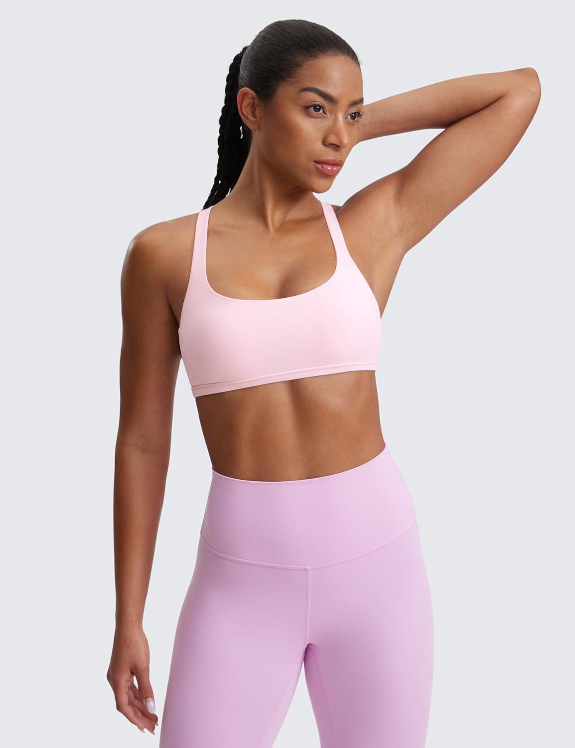 imageCRZ YOGA Womens Naked Feeling Criss Cross Sports Bra Strappy Back Padded Medium Support Wireless Gym Cami Workout YogaStrawberry Pink