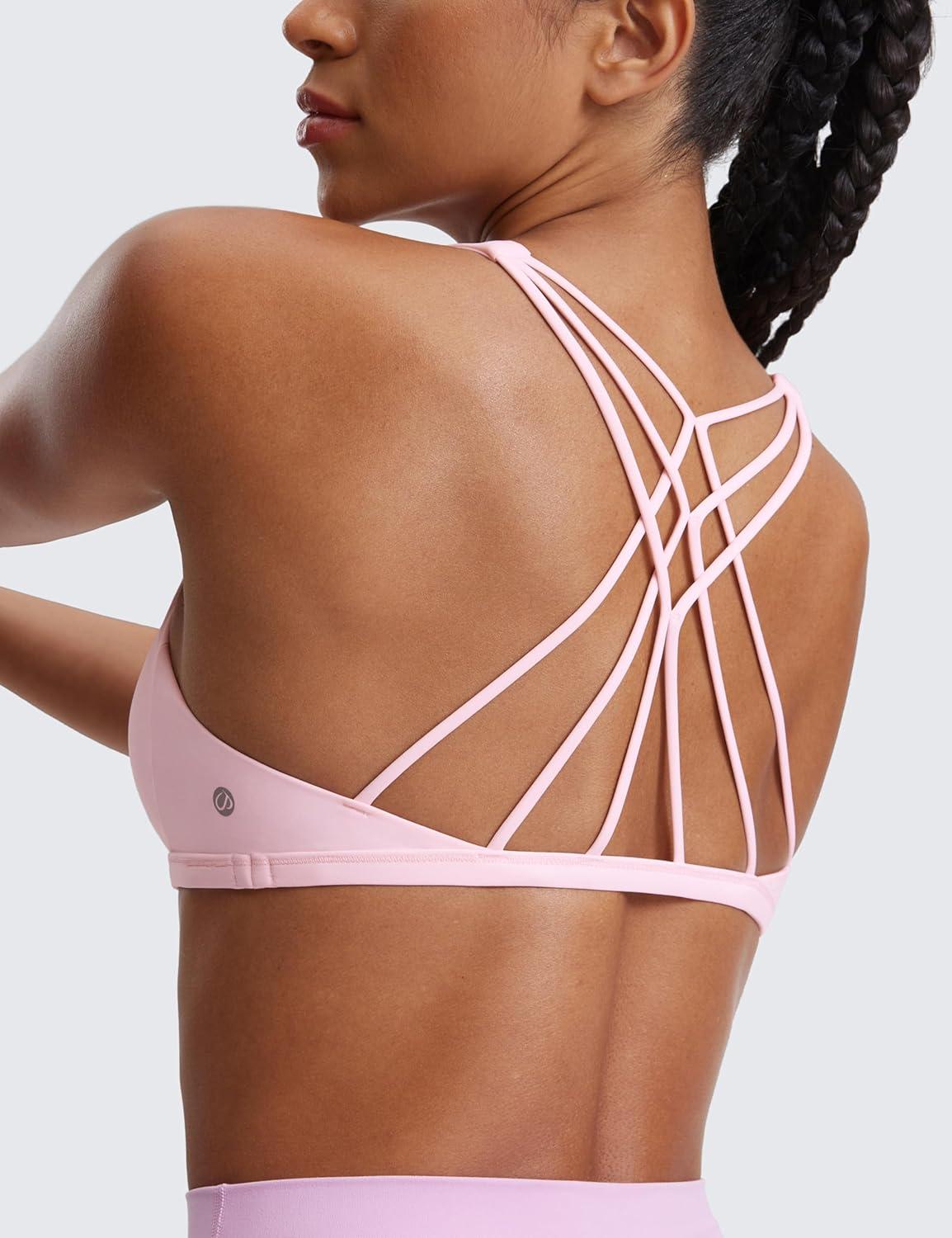 imageCRZ YOGA Womens Naked Feeling Criss Cross Sports Bra Strappy Back Padded Medium Support Wireless Gym Cami Workout YogaStrawberry Pink