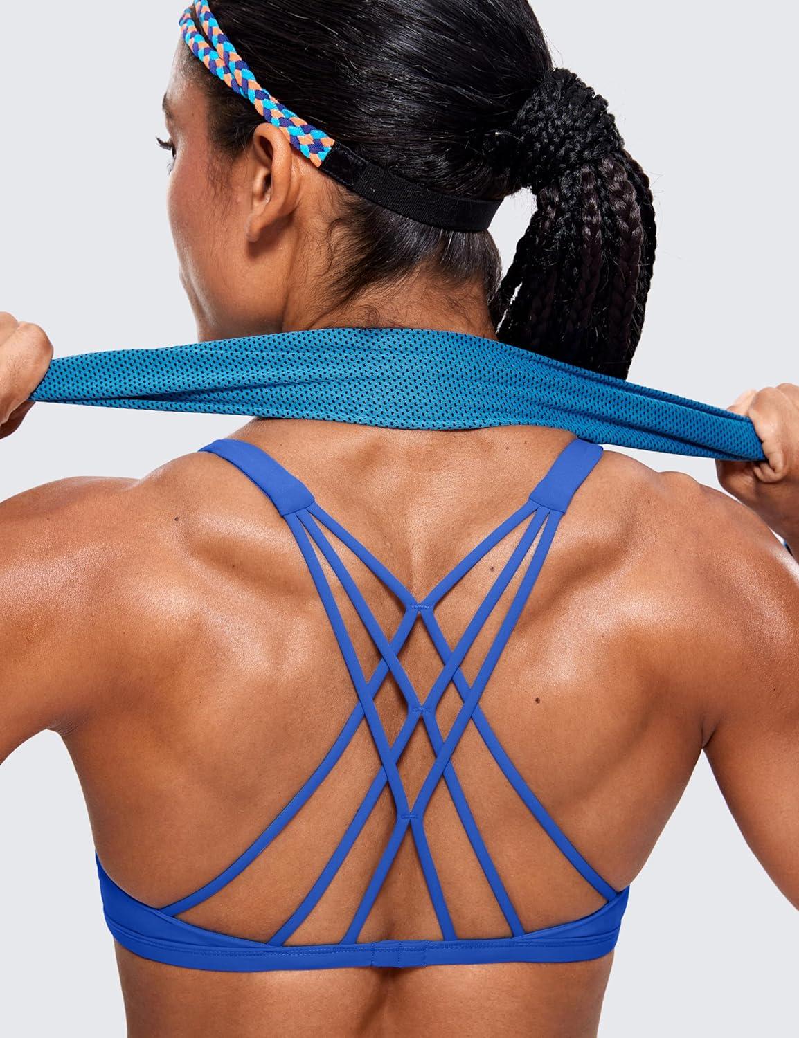 imageCRZ YOGA Womens Naked Feeling Criss Cross Sports Bra Strappy Back Padded Medium Support Wireless Gym Cami Workout YogaWaves Blue
