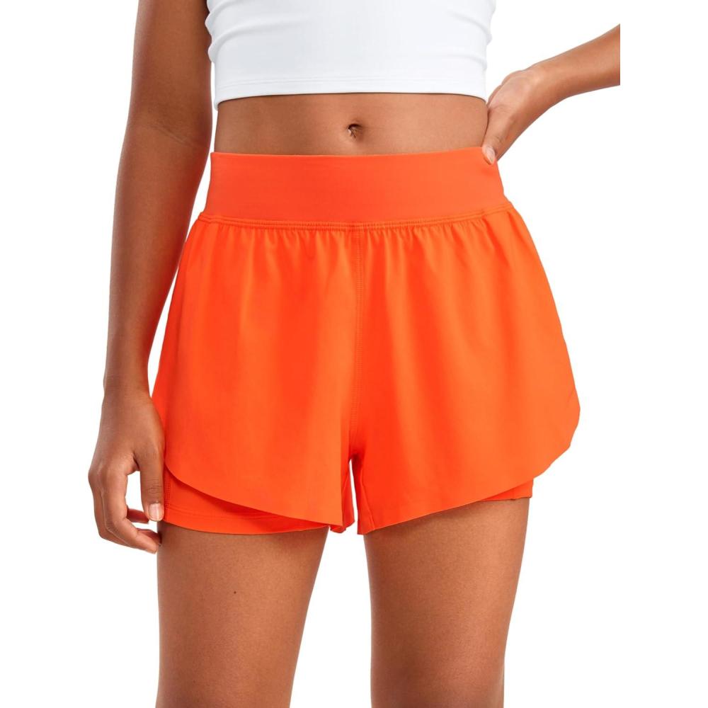 imageCRZ YOGA Girls FeatheryFit Soft 2 in 1 Dolphin Athletic Shorts Tennis Soccer Running Casual Liner Pockets Kids TeenNeon Orange