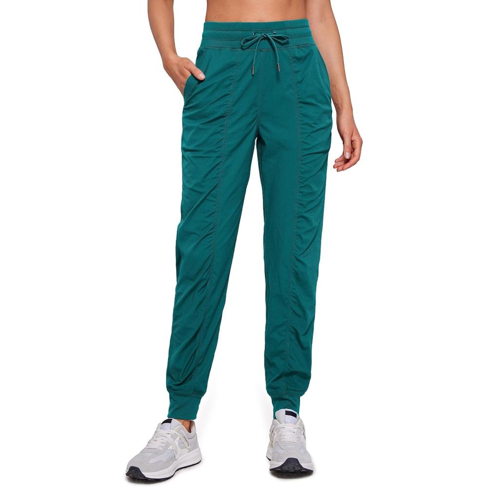 imageCRZ YOGA Lightweight Workout Joggers for Women 26quot285quot305quot Outdoor Running Casual Pants with PocketsGreen Jade