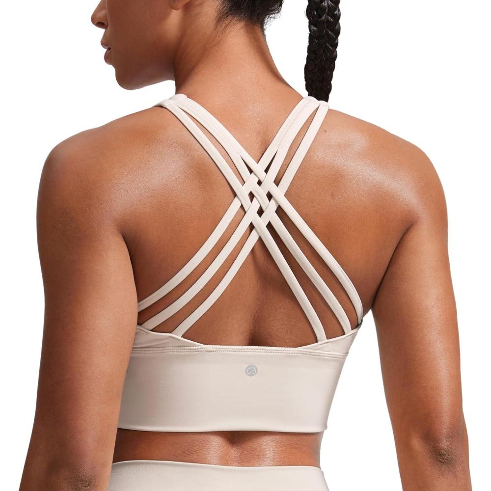 imageCRZ YOGA Naked Feeling Criss Cross Longline Sports Bras for Women Wirefree Padded Strappy Yoga Cropped TopsMojave Tan