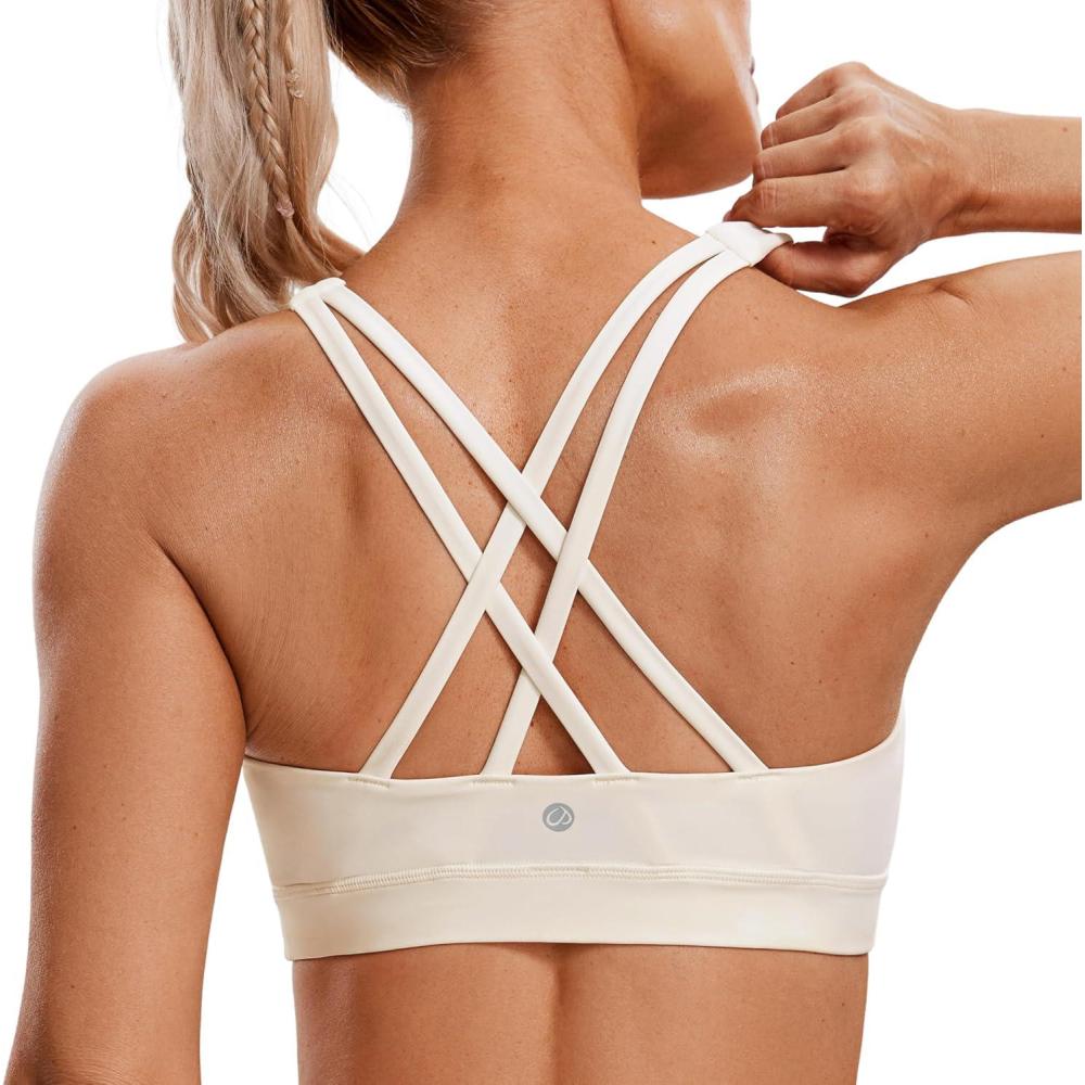 imageCRZ YOGA Naked Feeling Strappy Padded Sports Bras for Women  Fitness Workout Top Criss Cross Back Yoga CamiWhite Apricot