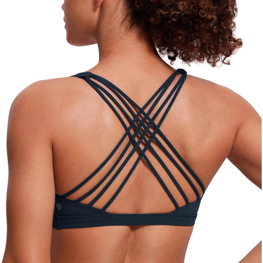 imageCRZ YOGA Naked Feeling Strappy Sports Bras for Women  Criss Cross Back Wireless Padded Cami Yoga Workout TopTrue Navy