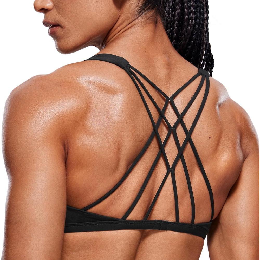 imageCRZ YOGA Womens Naked Feeling Criss Cross Sports Bra Strappy Back Padded Medium Support Wireless Gym Cami Workout YogaBlack