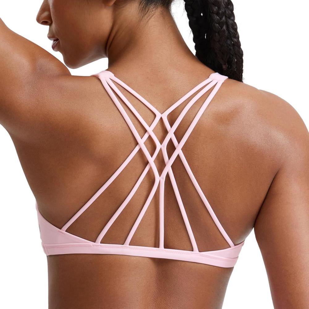 imageCRZ YOGA Womens Naked Feeling Criss Cross Sports Bra Strappy Back Padded Medium Support Wireless Gym Cami Workout YogaStrawberry Pink