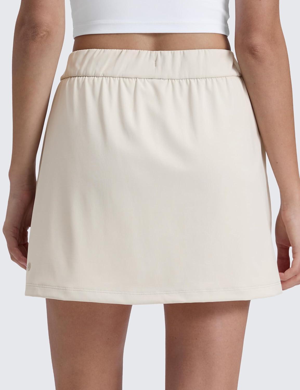 imageCRZ YOGA 4Way Stretch A Line Skirts for Women High Waitsted Mini Lined Tennis Work Drawstring Skort with PocketsMilky White